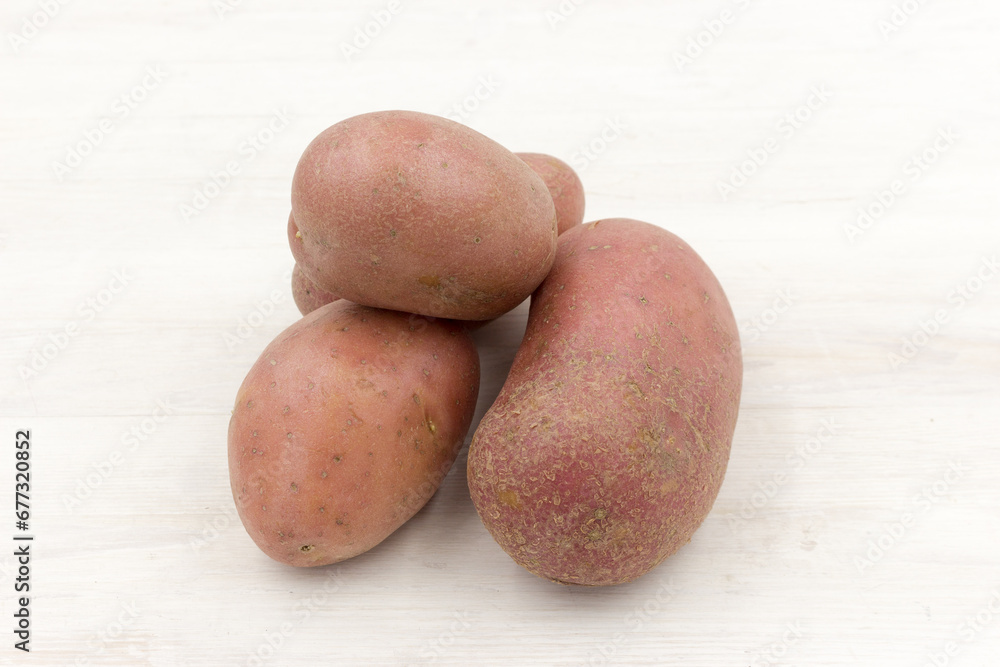 three red potatos background, close up three red potatos background, close up