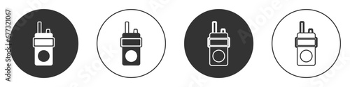 Black Walkie talkie icon isolated on white background. Portable radio transmitter icon. Radio transceiver sign. Circle button. Vector photo