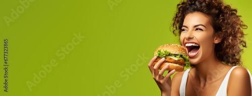 portrait of woman eating delicious cheeseburger on color background, generative ai