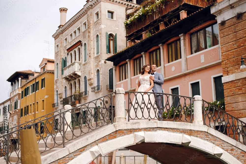 Happy Wedding couple enjoying romantic time in Venice, italy