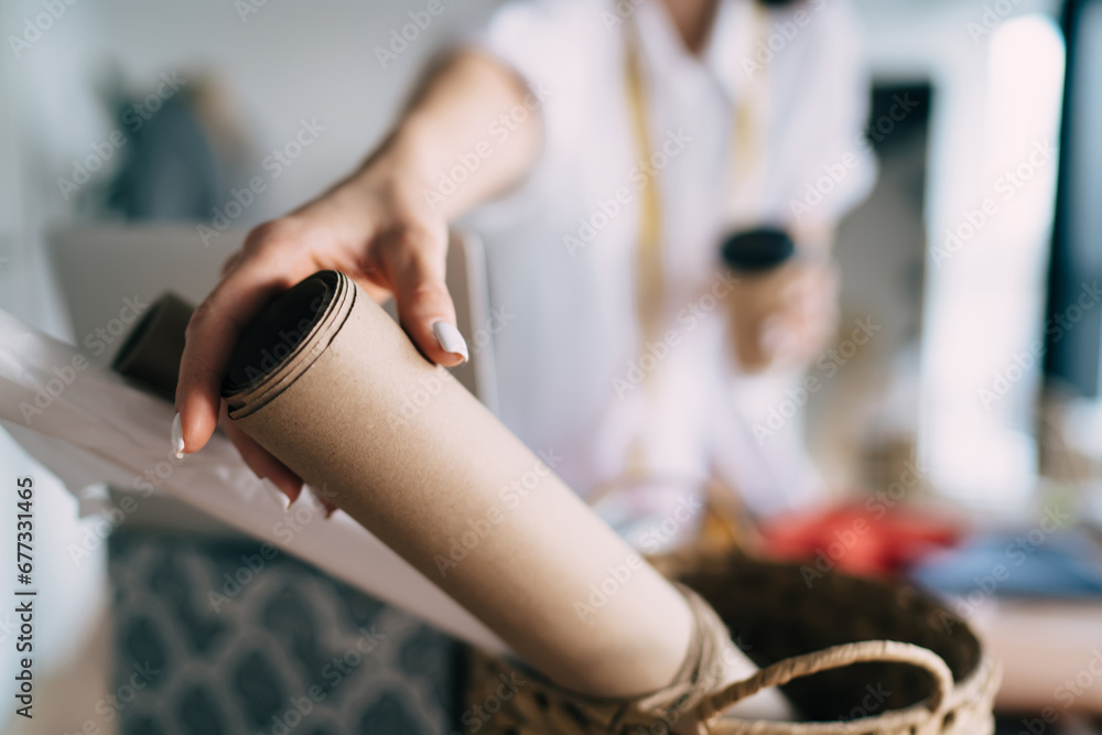 Woman with cup of hot drink taking pattern