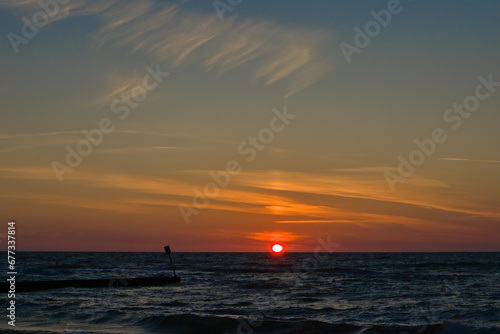 romantic sunset on the beach © Andrzej