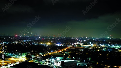 Wallpaper Mural Aerial Forward Shot Of Fireworks Exploding In Illuminated City Under Sky At Night - Culver City, California Torontodigital.ca