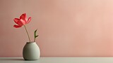  a vase with a single red flower in it on a table next to a pink wall and a white vase with a single red flower in it.