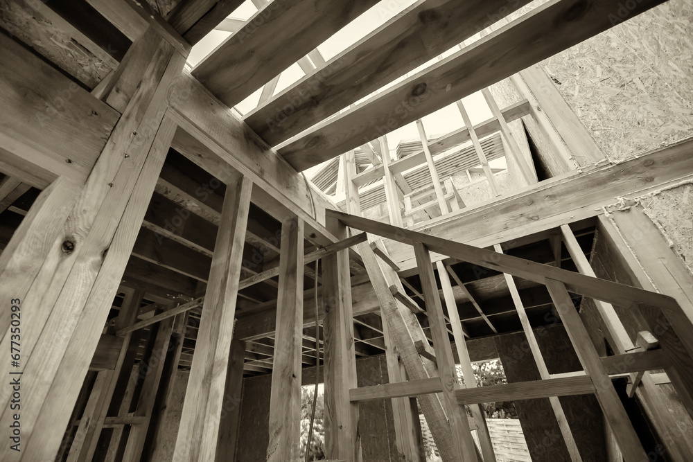 A new ecological wooden house in a rural area, built only from wooden elements, interior view, black and white image, sepia. A new ecological wooden house in a rural area, built only from wooden elements, interior view, black and white image, sepia.