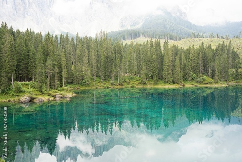 Fototapeta Naklejka Na Ścianę i Meble -  Beautiful view of a Lake with Dolomites in the background in Italy