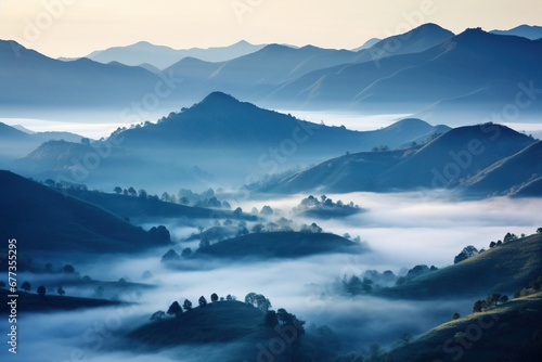 Dense fog blanketing undulating hills at dawn, creating a mystical atmosphere © Dan