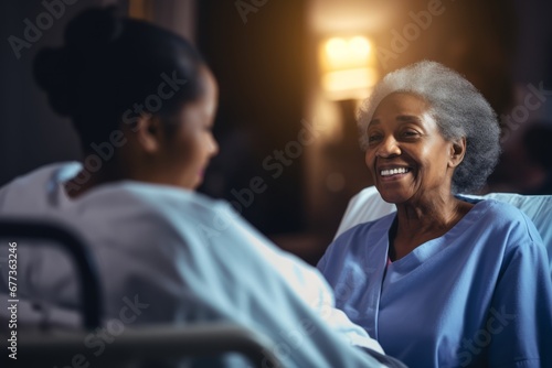 black afro nurse taking care of an old woman in the hospital photo
