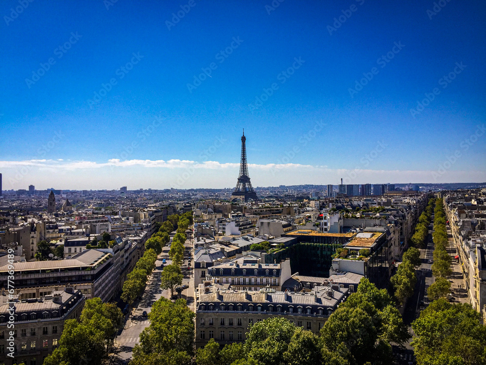 Beautiful view of the Eiffel tower in Paris city under a blue sky
