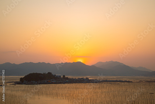 Shajiang Village, Shajiang Town, Xiapu County, Ningde City-Shajiang S Bay-Scenery of the fishing village beach facing the sky at sunset photo