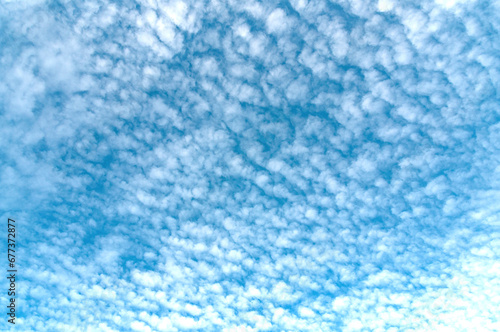 Cirrus clouds floating high in the sky..Blue sky with cirrus clouds floating across it. Beginning of winter  November.