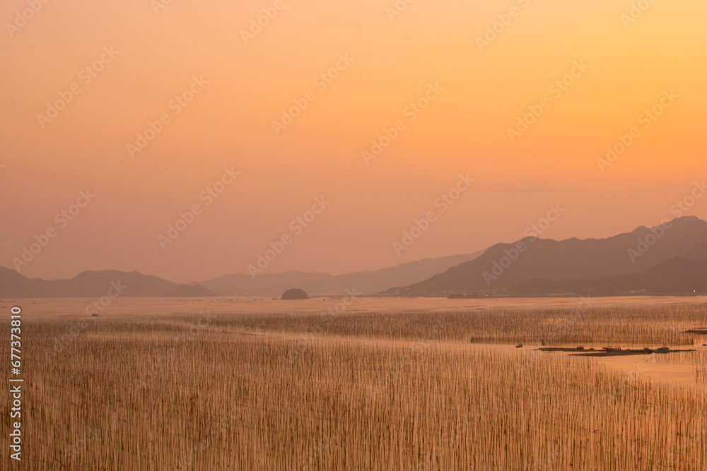 Fototapeta premium Shajiang Village, Shajiang Town, Xiapu County, Ningde City-Shajiang S Bay-Scenery of the fishing village beach facing the sky at sunset