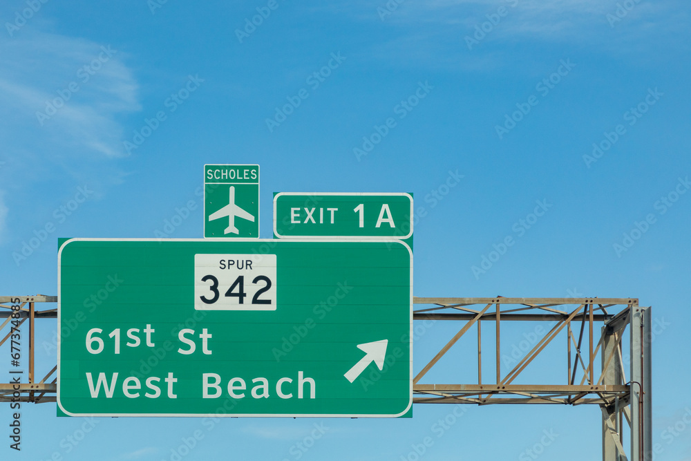 signage at highway at Galveston with exit west beach and direction scholes airport in Galveston, Texas