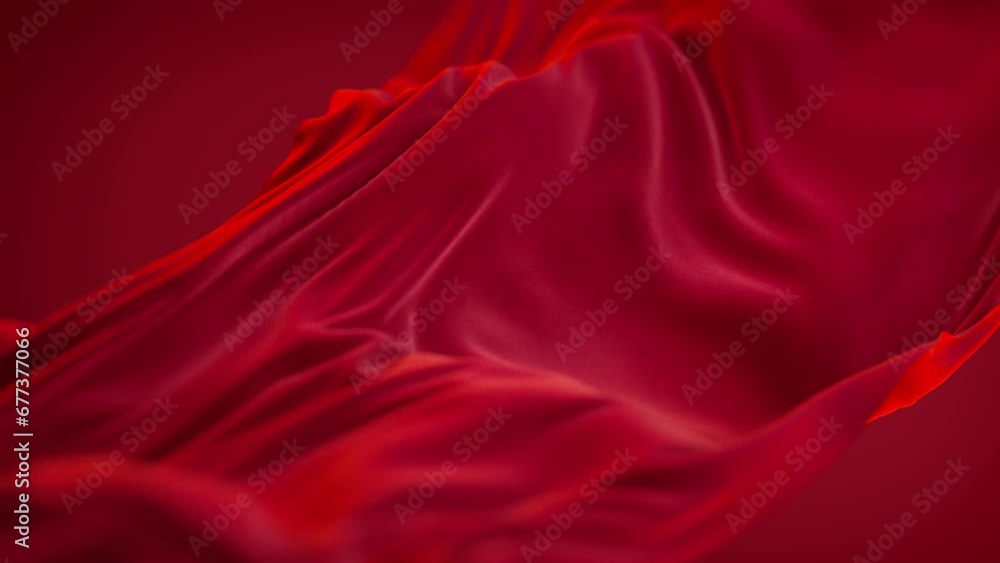 Red satin fabric floating slowly, close up on wavy luxury silk cloth flying in the air. Red satin fabric floating slowly, close up on wavy luxury silk cloth flying in the air.