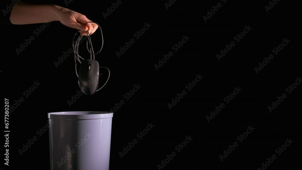 Throw out computer mouse. A person throw the computer mouse into the ...