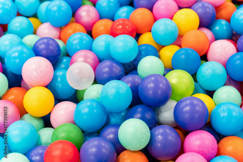 Pool of multicolored balls in close-up. Entertainment for children in the children's playroom.