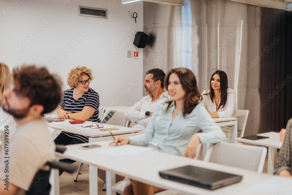 Group of businesspeople gathered in a seminar meeting in a white classroom, conference meeting Group of businesspeople gathered in a seminar meeting in a white classroom, conference meeting