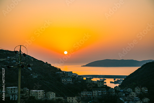 Xiaoruo Village, Wenling City, Taizhou City, Zhejiang Province - sea view and fishing village at sunrise photo