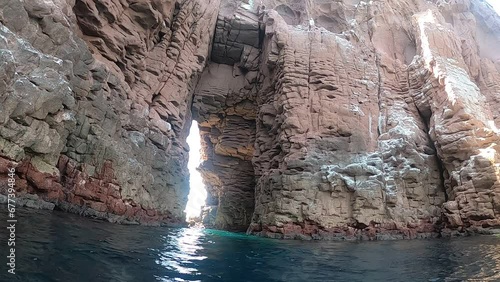 Snorkelling near a natural sea arch at Isla Espiritu Santo near La Paz, Baja California Sur, Mexico photo