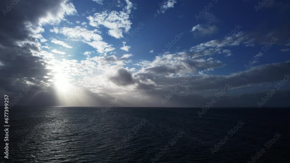 Scenic view of beautiful ocean of clouds at sunset. Sun is rising above the endless sea of clouds until the horizon. Amazing nature landscape, scenic light rays hit the clouds. Dark water before rain Scenic view of beautiful ocean of clouds at sunset. Sun is rising above the endless sea of clouds until the horizon. Amazing nature landscape, scenic light rays hit the clouds. Dark water before rain
