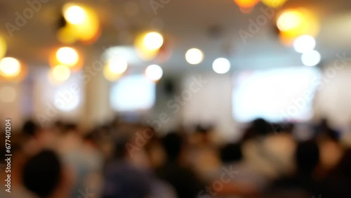 Blurred background people join seminar business event in auditorium hall convention.  Presentation meeting at conference room present screen business. Blurred background with copy space photo