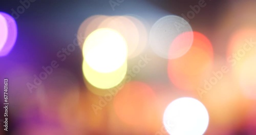 Colorful Bokeh abstract blurred background music festival stage show performance party. Vibrant bokeh background spark animate motion. Backdrop display with twinkling night life shape blinking light