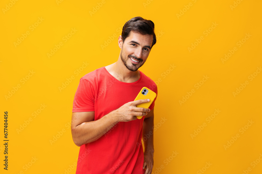 Man mobile copy studio portrait yellow communication cyberspace space smartphone phone smiling phone happy Man mobile copy studio portrait yellow communication cyberspace space smartphone phone smiling phone happy
