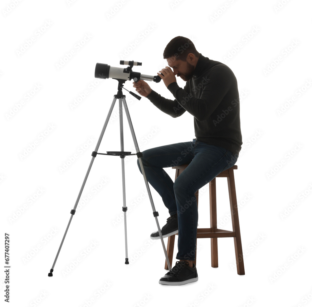 Astronomer looking at stars through telescope on white background