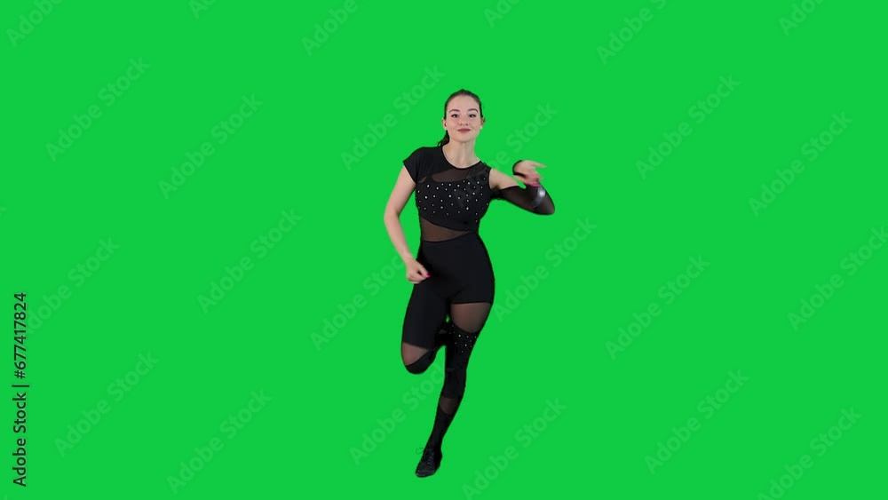 Attractive Woman Dancer in Black Bodysuit dancing in front of a Green screen Attractive Woman Dancer in Black Bodysuit dancing in front of a Green screen