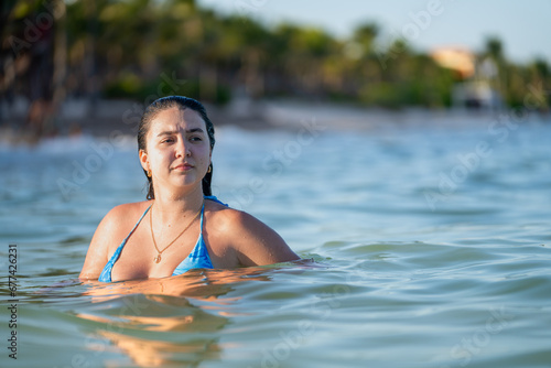 Woman taking a bath in the Caribbean sea