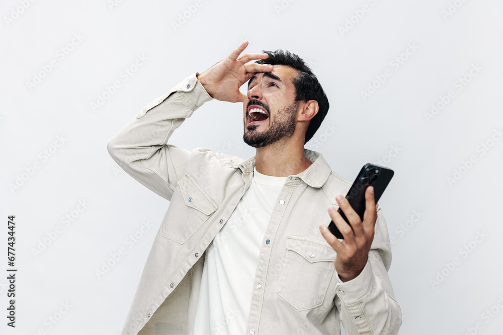 Closeup portrait man talking on the phone smiling and laughing happiness communication on white isolated background, fashionable clothing style, copy space, space for text Closeup portrait man talking on the phone smiling and laughing happiness communication on white isolated background, fashionable clothing style, copy space, space for text