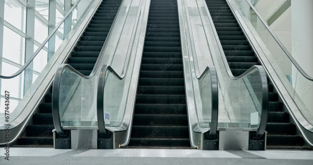 Escalator moving, machine and empty airport for travel in interior of building. Electronic, stairs and movement in office, mall or hotel technology for transportation on steps, stairway or staircase Escalator moving, machine and empty airport for travel in interior of building. Electronic, stairs and movement in office, mall or hotel technology for transportation on steps, stairway or staircase