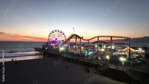 Santa Monica Pier At Los Angeles In California United States. Amusement Park Harbor Scenery. Ferris Wheel Landmark. Santa Monica Pier At Los Angeles In California United States.  photo