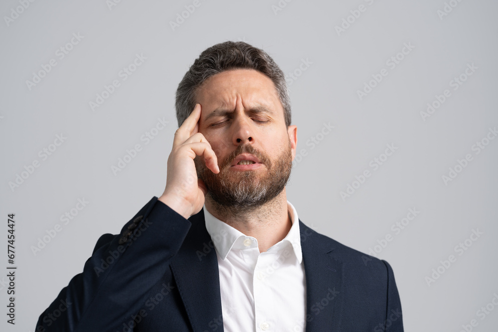 Businessman with stress and burnout. Business man got migraine touch head because of pain. Headache and strain. Headache, tiredness and stress. Businessman in suit with headache. Work Anxiety Businessman with stress and burnout. Business man got migraine touch head because of pain. Headache and strain. Headache, tiredness and stress. Businessman in suit with headache. Work Anxiety