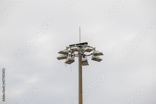 metal pipe, antenna, lamp, against the sky