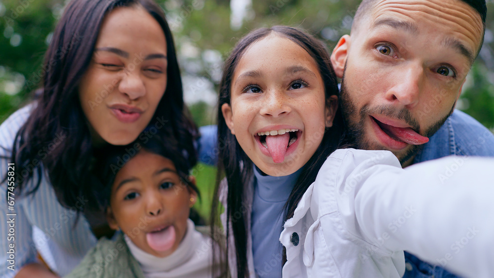 Funny selfie in park, parents and happy kids with smile, love and bonding on weekend in nature. Photography, fun and family memory, mother and father with children in green garden in playful portrait Funny selfie in park, parents and happy kids with smile, love and bonding on weekend in nature. Photography, fun and family memory, mother and father with children in green garden in playful portrait