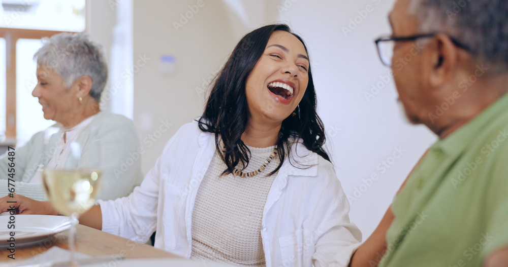 Fototapeta premium Happy, woman and laugh with family at dinner in home, living room and joke with grandparents. Senior man, talking and lady smile at comedy or conversation at celebration, event or lunch together