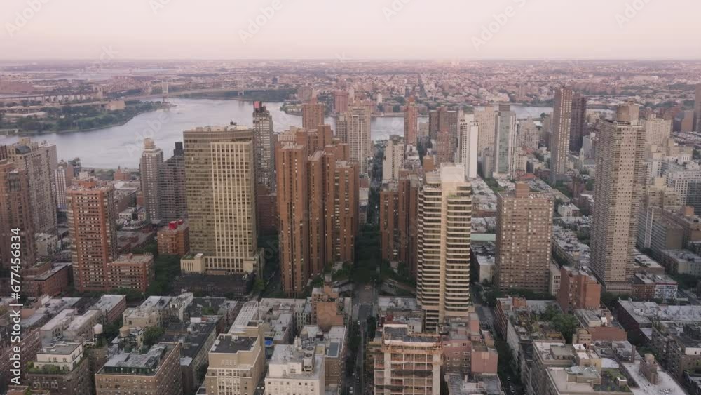 Cinematic Upper East side panorama. Prestige luxury real estate properties and business offices in skyscrapers on Manhattan. Epic aerial scenic New York City views in warm sepia colors background Cinematic Upper East side panorama. Prestige luxury real estate properties and business offices in skyscrapers on Manhattan. Epic aerial scenic New York City views in warm sepia colors background