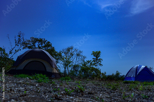 Camping tents under starry sky