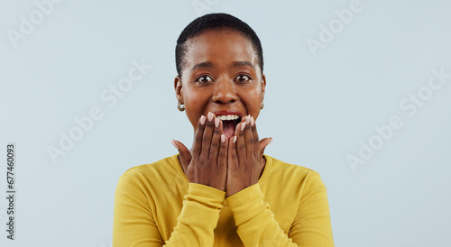 Happy black woman, portrait and surprise in wow, winning or lucky prize against a studio background, Face of excited African female person smile in joy for bonus, promotion or sale promo in discount