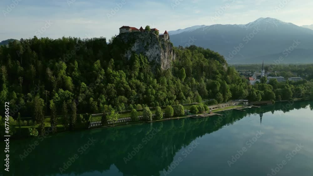 Aerial view of Bled lake with castle on the rock in morning light, Slovenia, 4k Aerial view of Bled lake with castle on the rock in morning light, Slovenia, 4k
