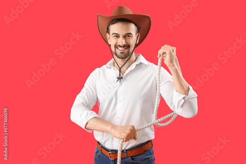 Handsome cowboy with lasso ...
