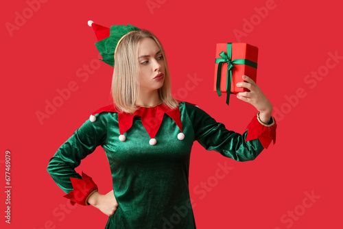 Young woman in elf costume ...