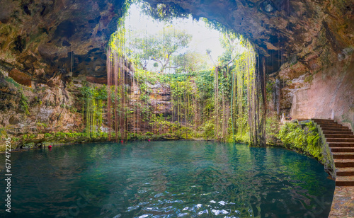 Ik-Kil Cenote - Lovely cenote in Yucatan Peninsulla with transparent waters and hanging roots. Chichen Itza, Mexico photo