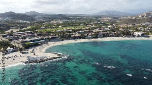 Aerial of coast of Palmilla Beach in Cabo San Lucas, an slice of paradise on the southern tip of the Baja California Peninsula. Coastal rental apartments on the shore. photo