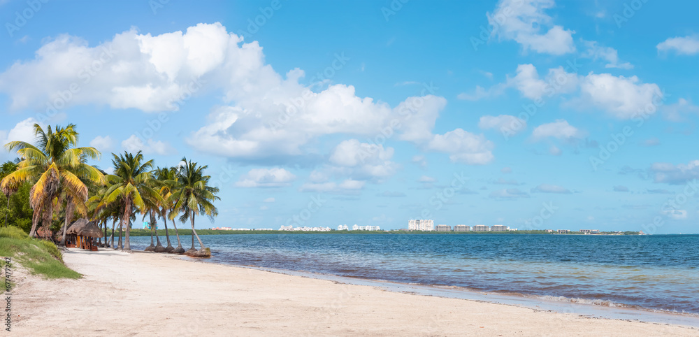 Paradise Sunny beach with palms and turquoise sea. Summer vacation and tropical beach concept - Cancun, Mexico