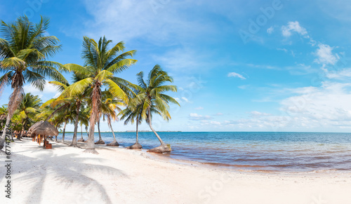 Paradise Sunny beach with palms and turquoise sea. Summer vacation and tropical beach concept - Cancun  Mexico