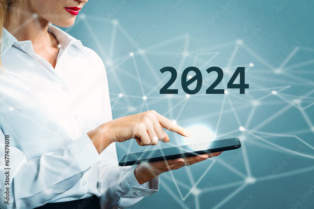 2024 text with business woman using a tablet 2024 text with business woman using a tablet