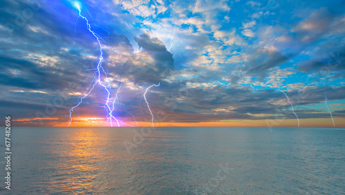 Amazing sunset over the stormy sea thunder and lightning in the background