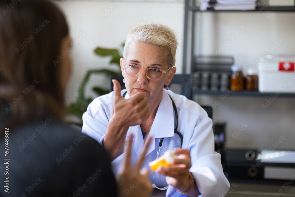 Doctor giving pill to female patient at medical office in hospital. medicine, healthcare concept Doctor giving pill to female patient at medical office in hospital. medicine, healthcare concept